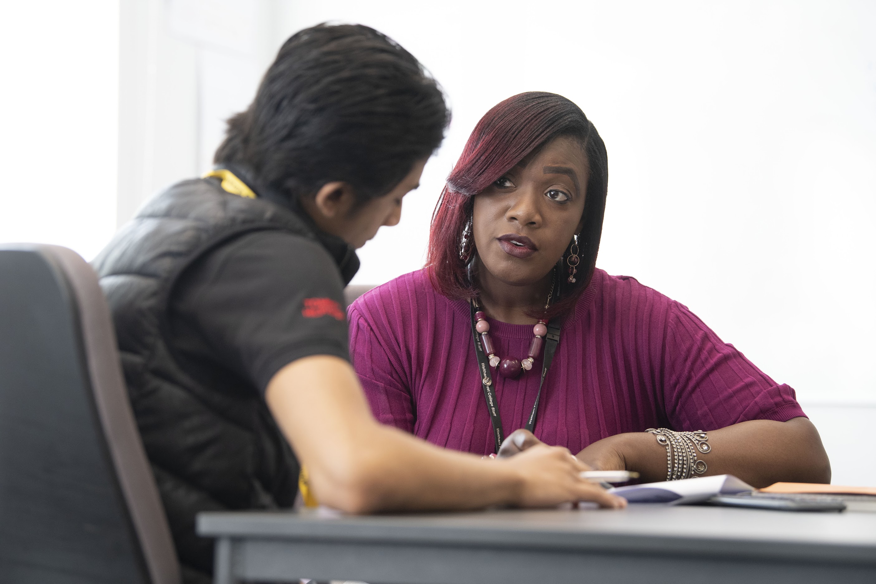 Teacher And Student In Maths Lesson