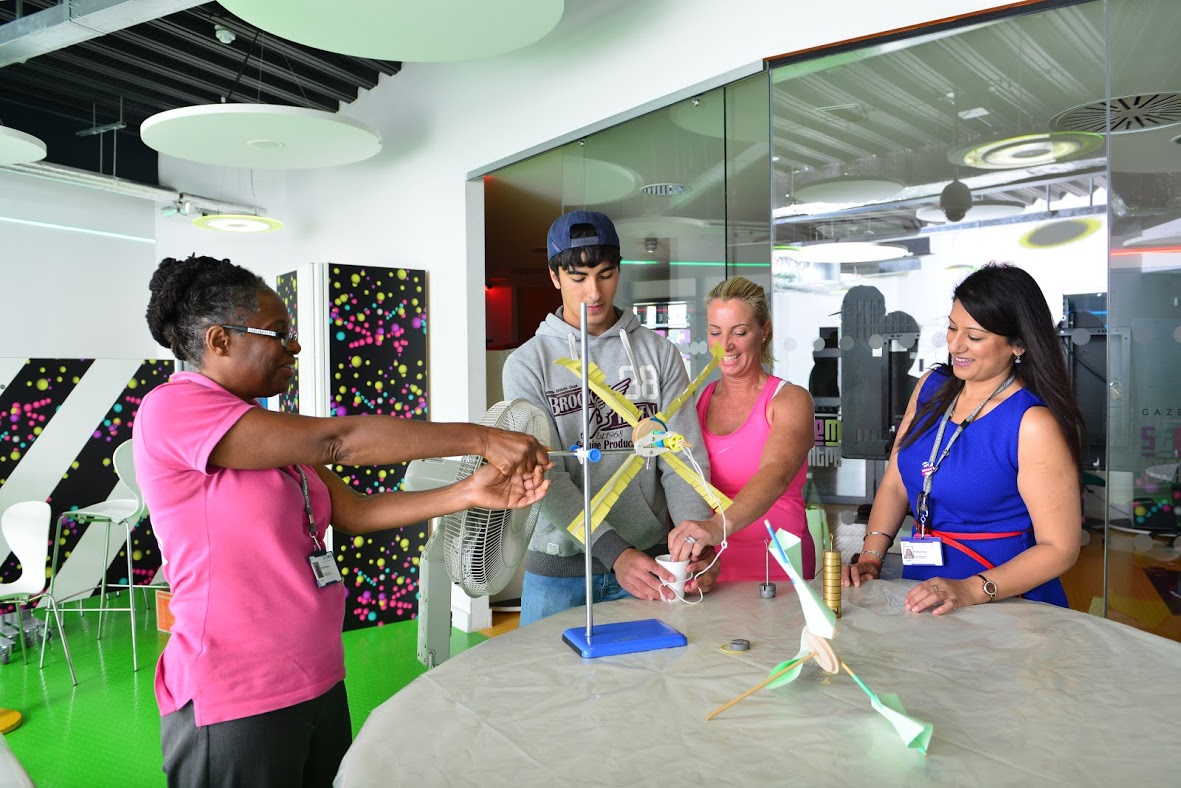 Students And Teacher Working On A Science Project