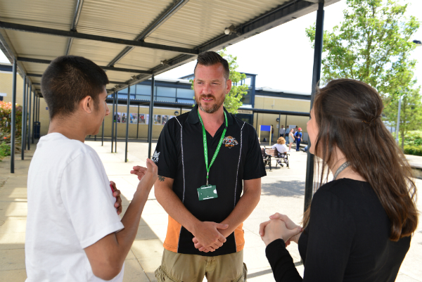 Students and tutor outside a college
