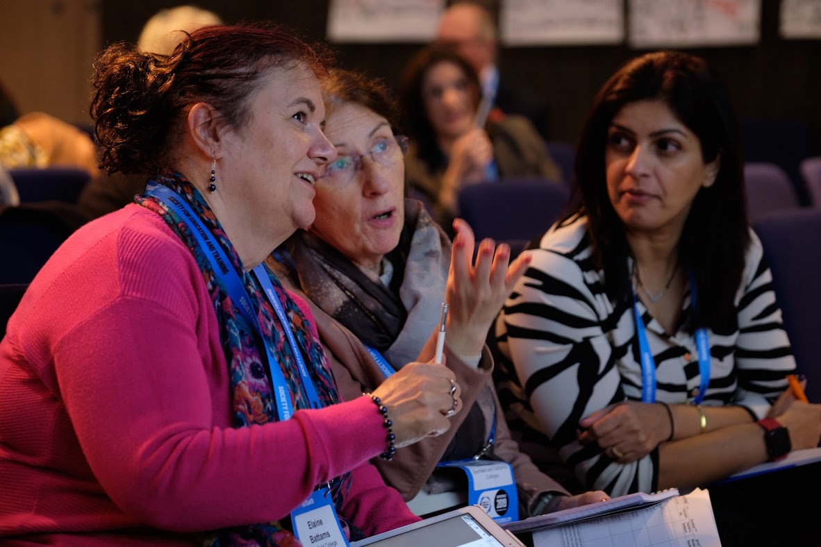 Three Set Conference Attendees In Discussion