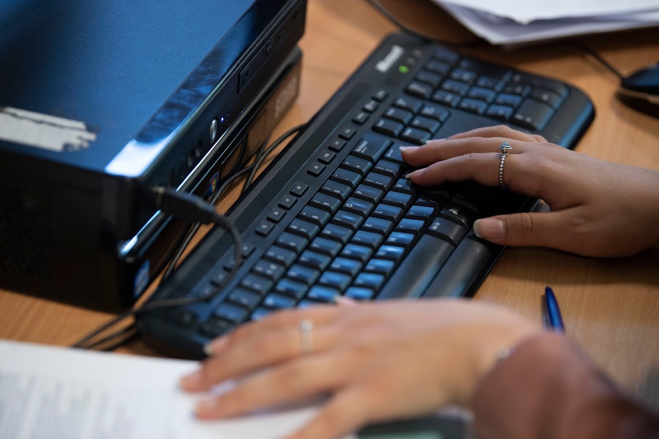 close up image of someone using a computer keyboard