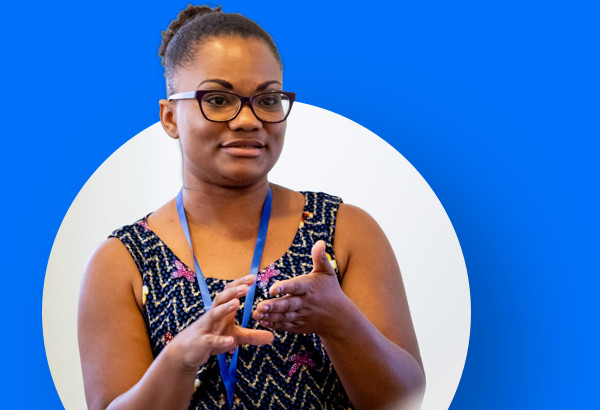 Teacher standing talking to students