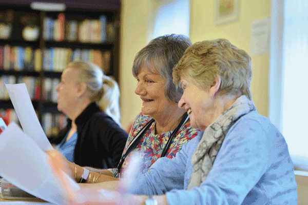 two students in adult community education learning