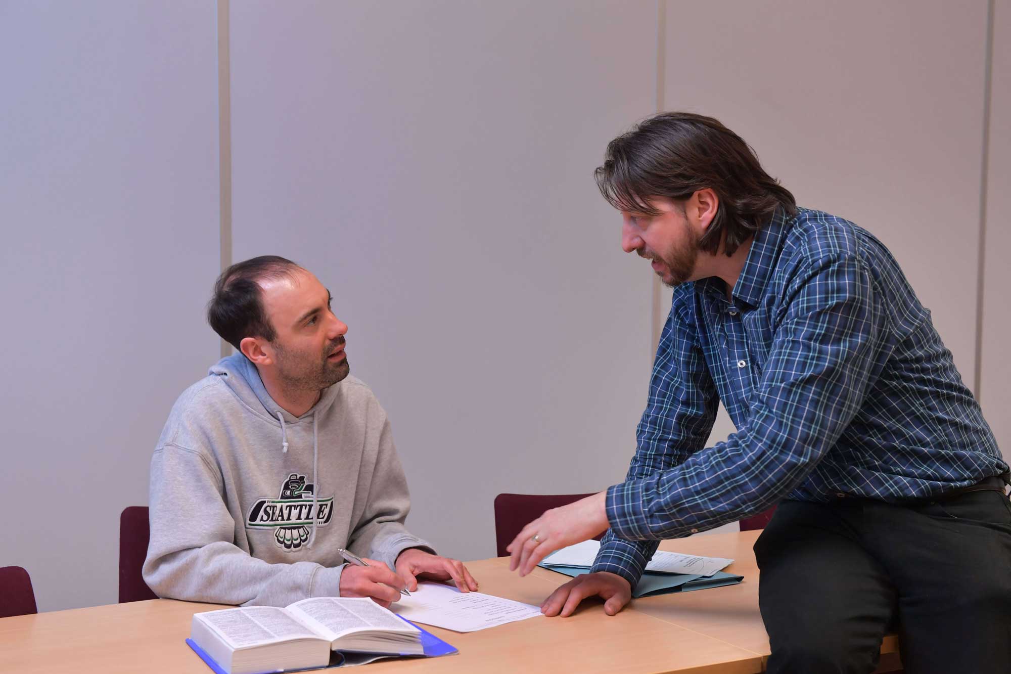 Tutor and Student In English Lesson